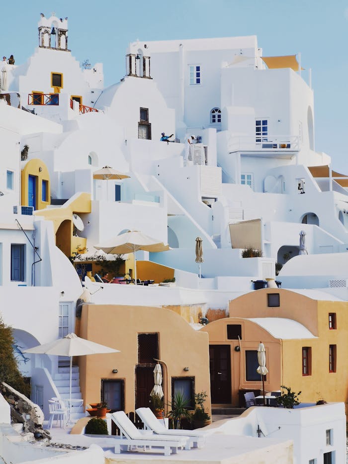 Explore the iconic whitewashed homes and stunning architecture of Oia, Greece.